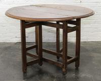 A Jacobean Oak Drop Leaf Table Height 28 x width 42 1/2 x depth 15 1/4 inches (closed). — 18TH/19TH CENTURY