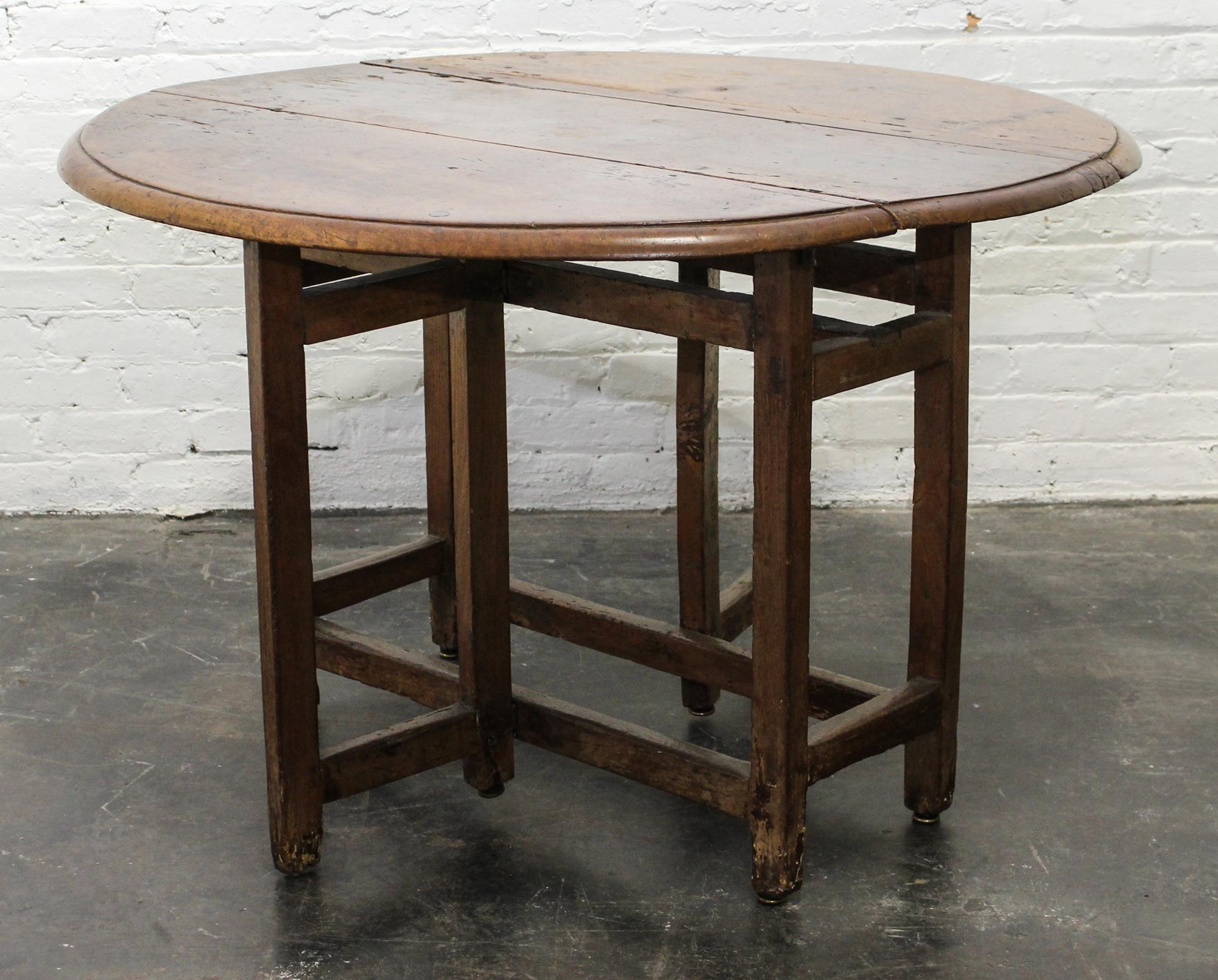 A Jacobean Oak Drop Leaf Table Height 28 x width 42 1/2 x depth 15 1/4 inches (closed). — 18TH/19TH CENTURY