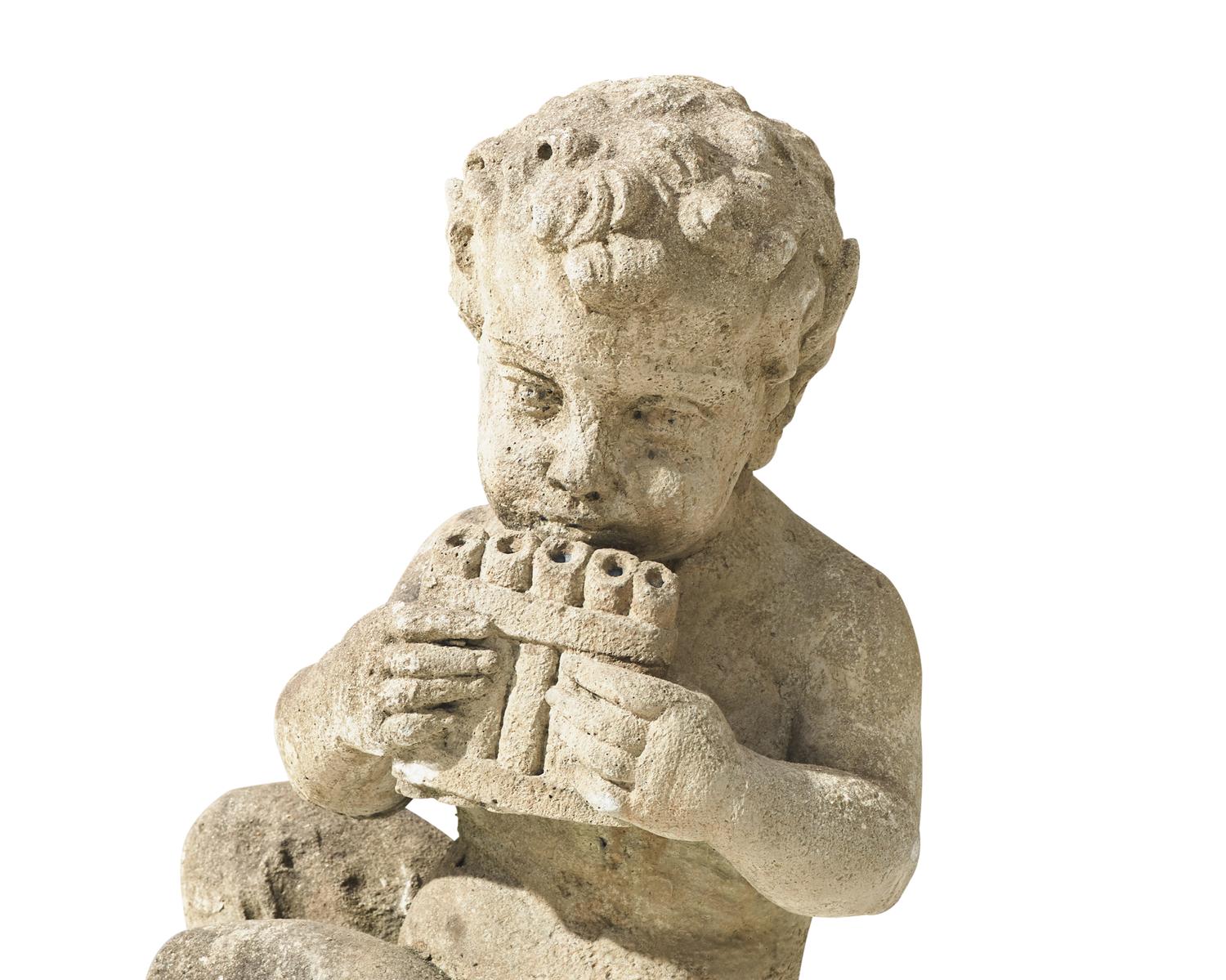 A small cast stone / concrete statue of a faun, early 20th century
