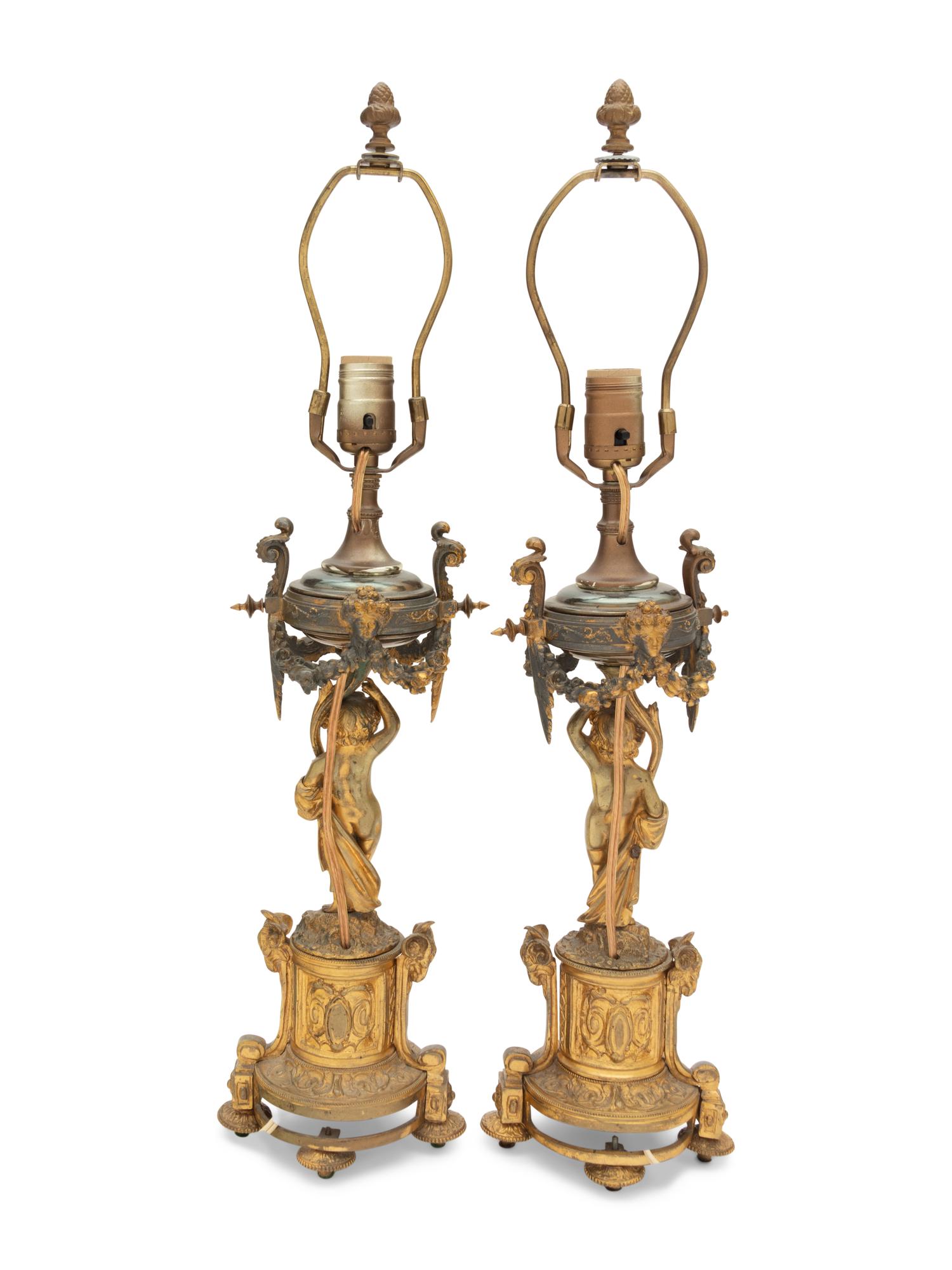 A Pair of French Porcelain Mounted Gilt Bronze Figural Lamps