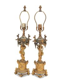 A Pair of French Porcelain Mounted Gilt Bronze Figural Lamps