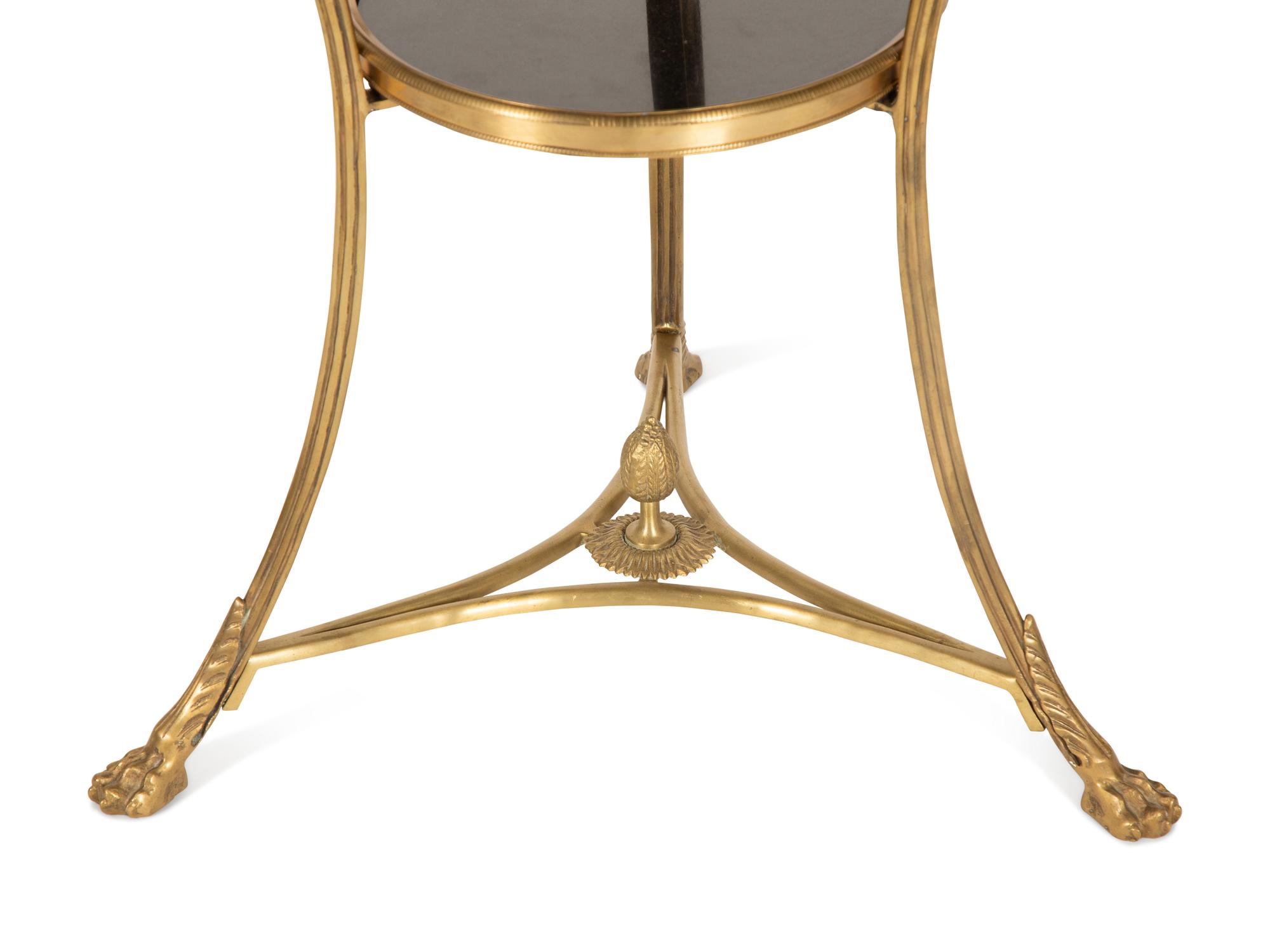 An Empire Style Gilt Metal and Black Granite Guéridon