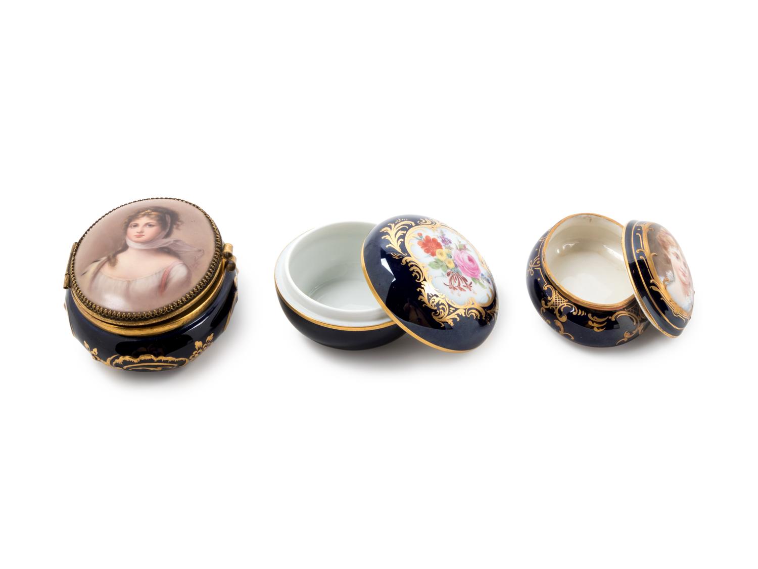 Three Continental Painted and Parcel Gilt Porcelain Boxes