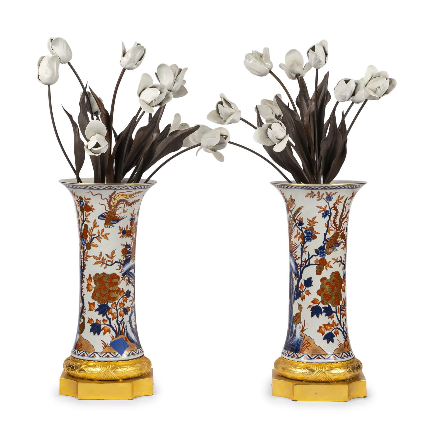 A Pair of Gilt Bronze Mounted Imari Palette Porcelain Vases with Biscuit Porcelain Tulip Arrangements