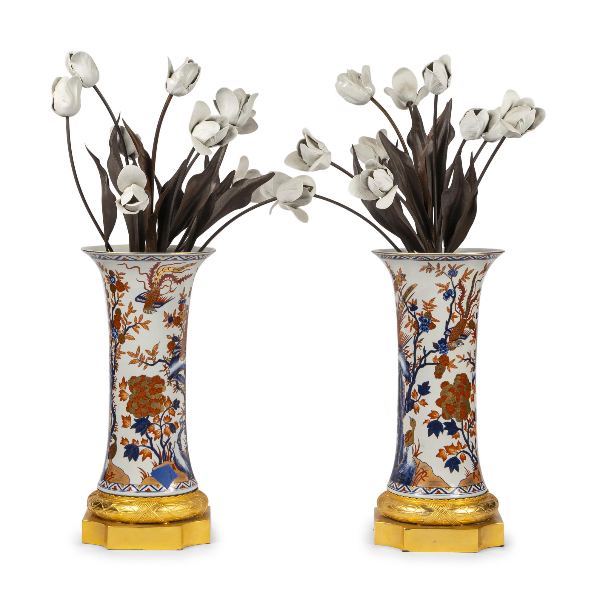 A Pair of Gilt Bronze Mounted Imari Palette Porcelain Vases with Biscuit Porcelain Tulip Arrangements
