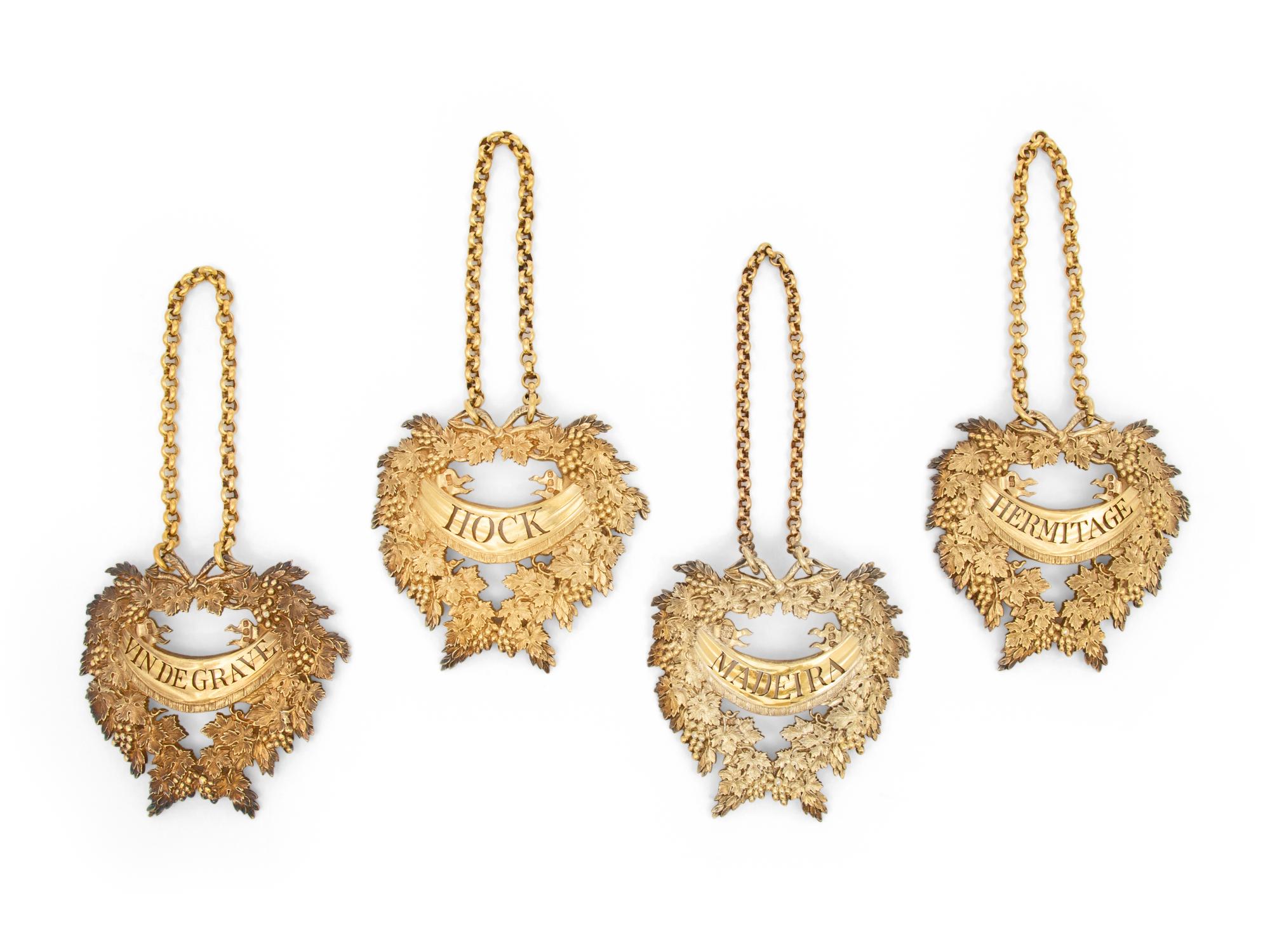 Four English Silver-Gilt Liquor Tags