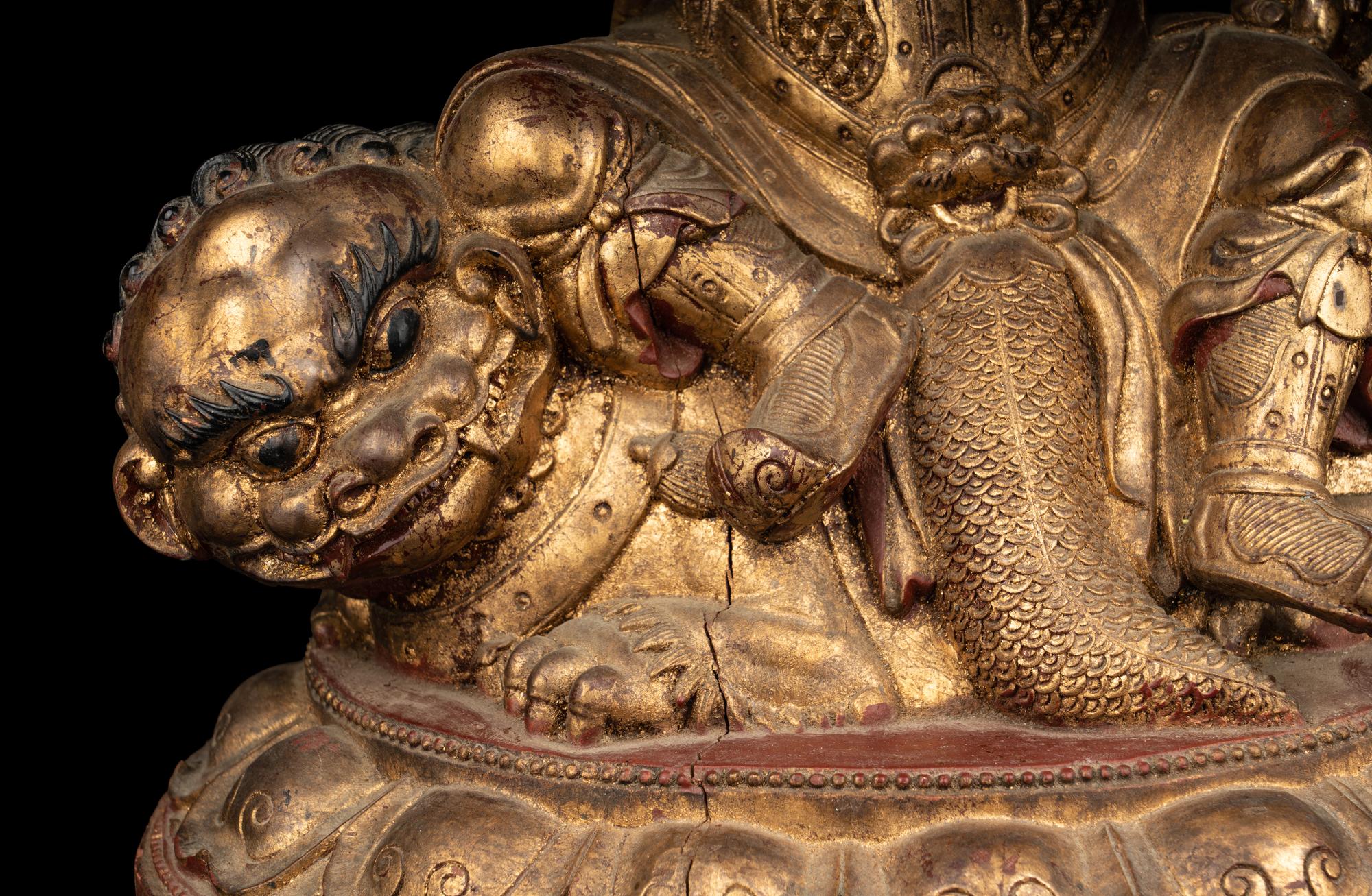 A Large and Rare Sino-Tibetan Gilt Lacquer Wood Figure of Vaishravana