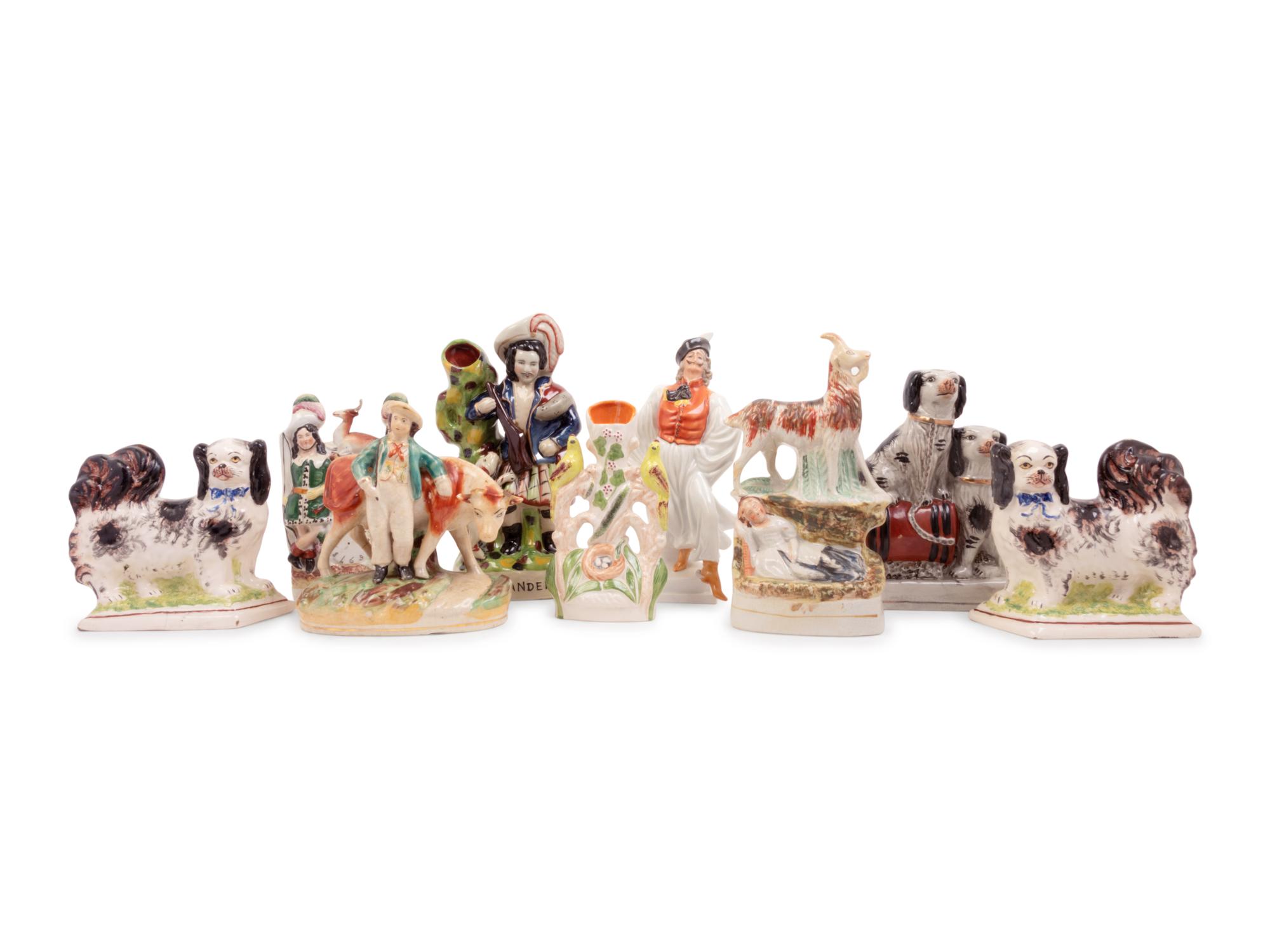 A Group of Eight Staffordshire Pottery Figures