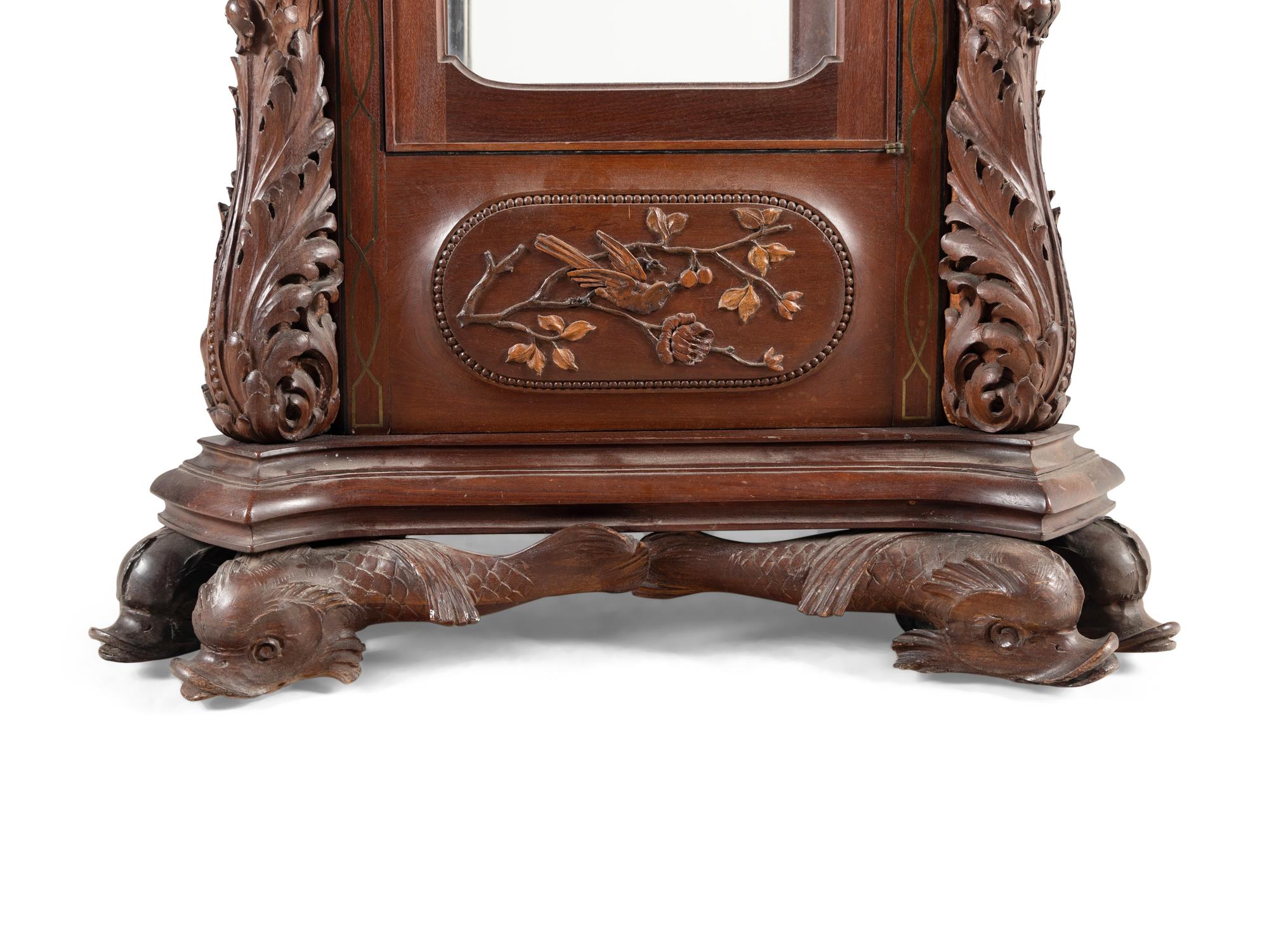 A Renaissance Revival Carved Mahogany Tube-Striking Tall Case Clock