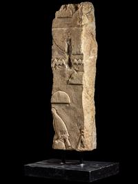 An Egyptian Limestone Relief Fragment with a Pharaoh