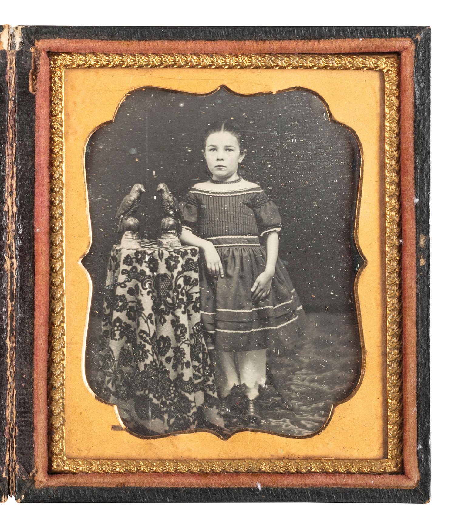 [EARLY PHOTOGRAPHY]. Sixth plate daguerreotype featuring a young girl with decorative bird figurines.
