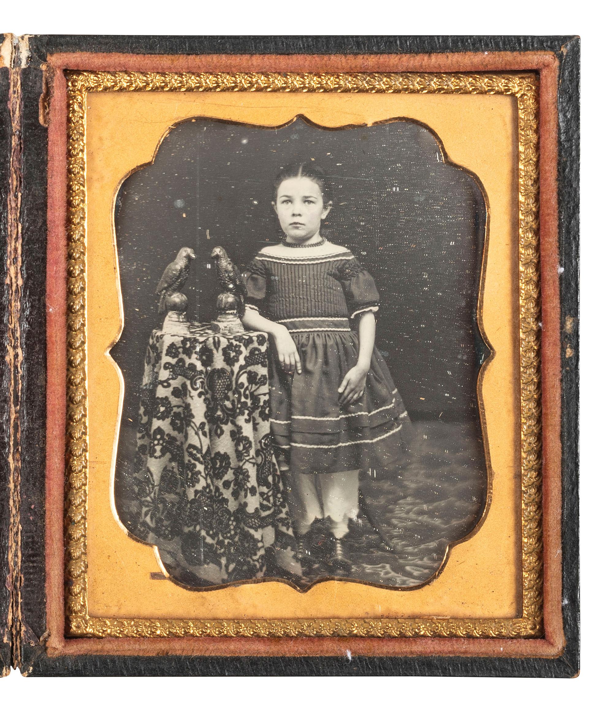 [EARLY PHOTOGRAPHY]. Sixth plate daguerreotype featuring a young girl with decorative bird figurines.