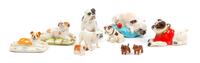 A Group of Ten Porcelain and Wood Bulldogs Width of widest 4 inches.