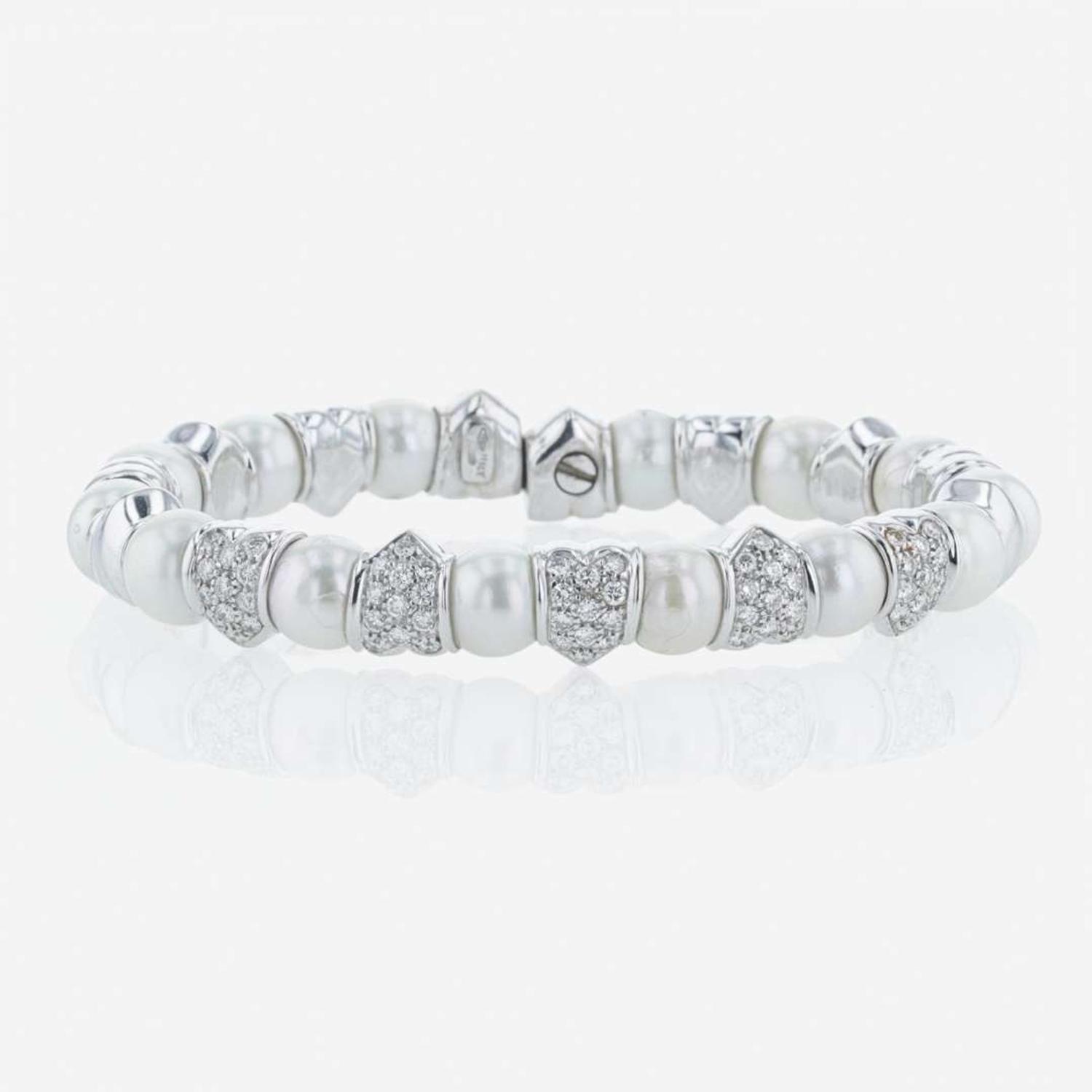 An 18K white gold, cultured pearl, and diamond bangle Italy