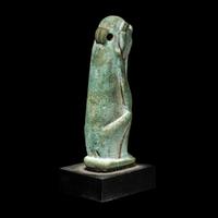 An Egyptian Faience Seated Monkey