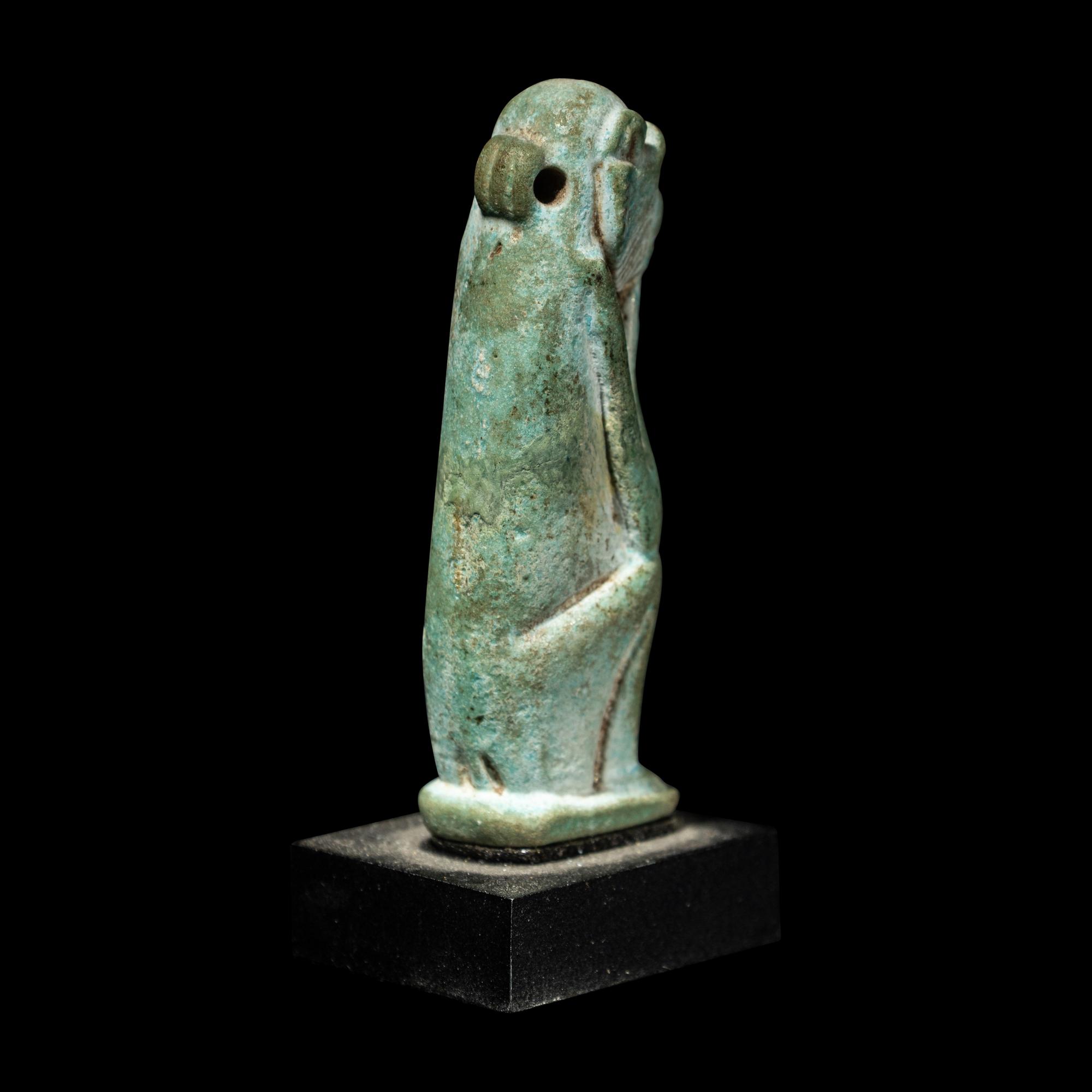 An Egyptian Faience Seated Monkey