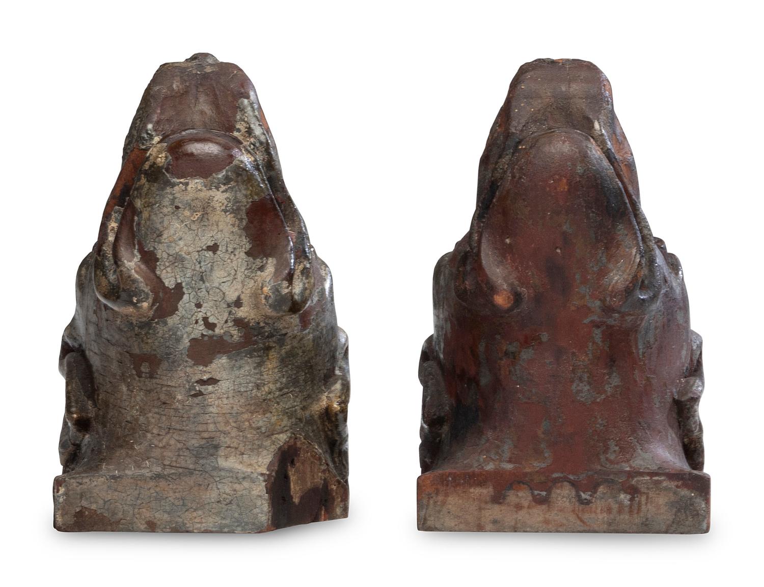 A Pair of Carved Walnut Dog-Form Wall Mounts