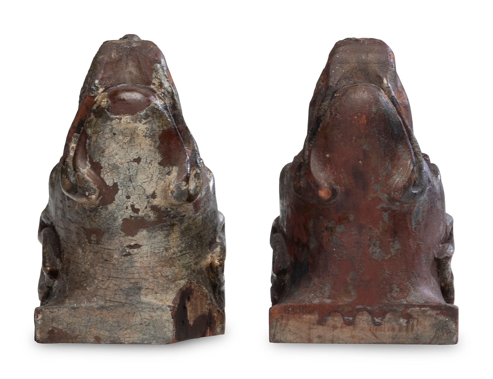 A Pair of Carved Walnut Dog-Form Wall Mounts