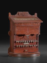 A Carved Wood Change Machine