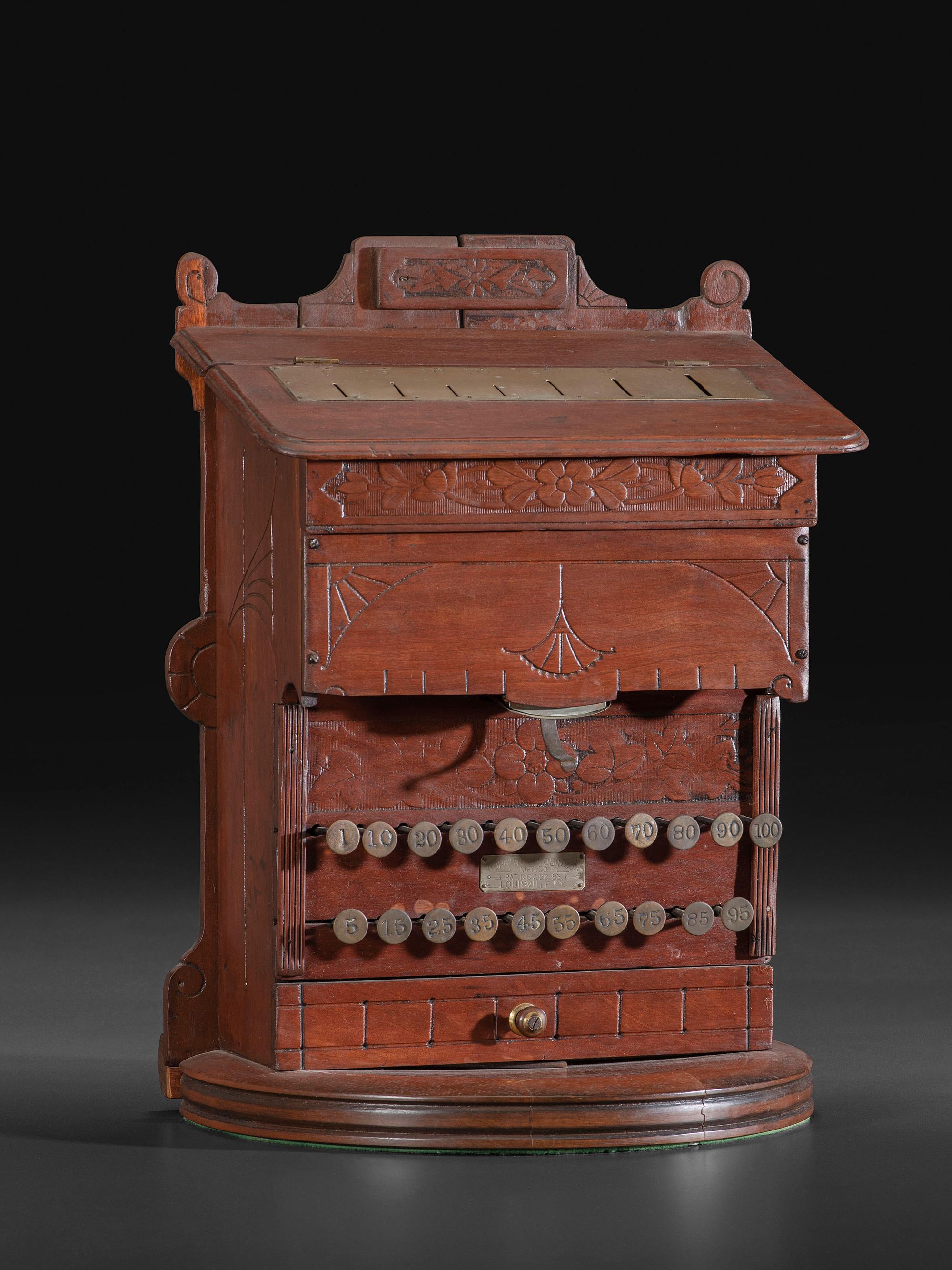 A Carved Wood Change Machine
