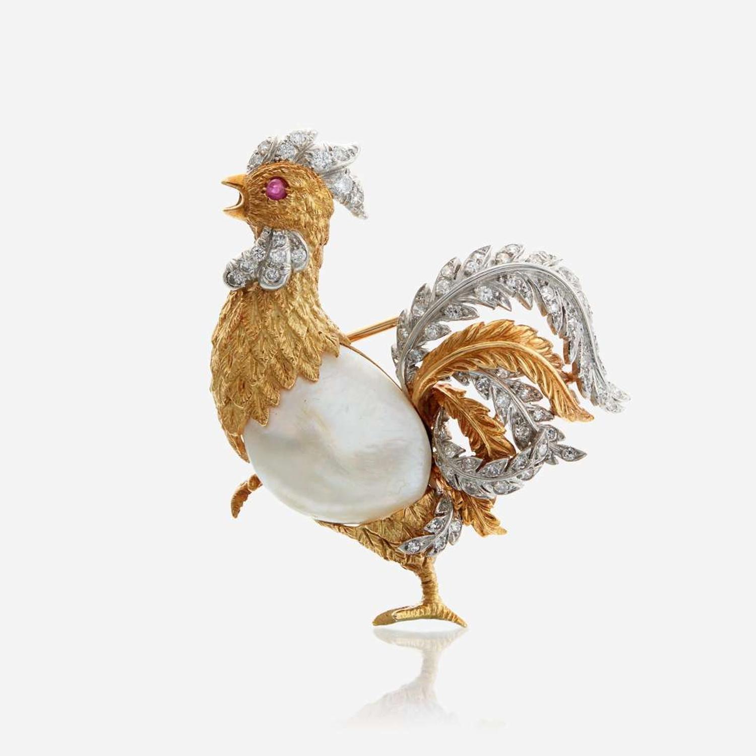 A bicolor gold, cultured pearl, diamond, and ruby brooch