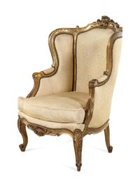 A Louis XV Style Carved Giltwood Bergère à Oreilles