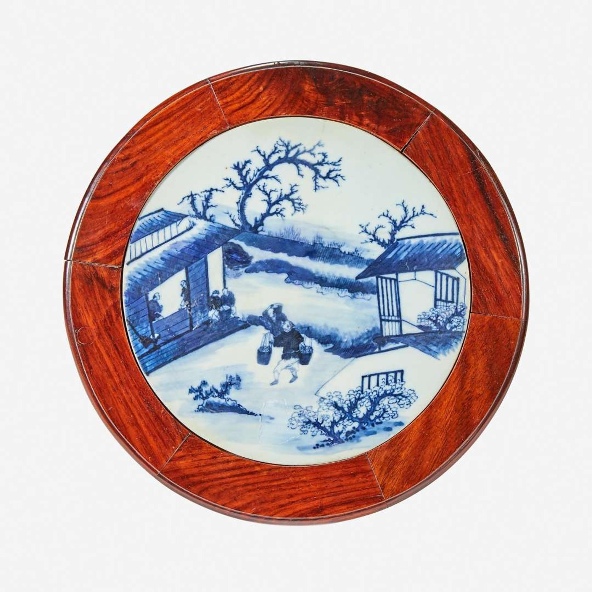 A Chinese blue and white porcelain-inset hardwood revolving small stand 20th Century