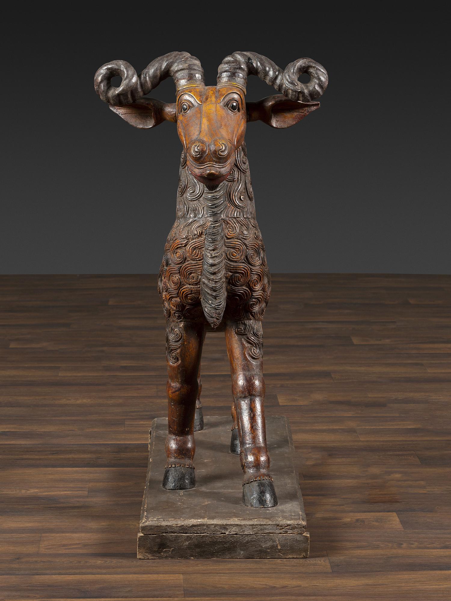 A Folk Art Carved and Painted Wood Ram