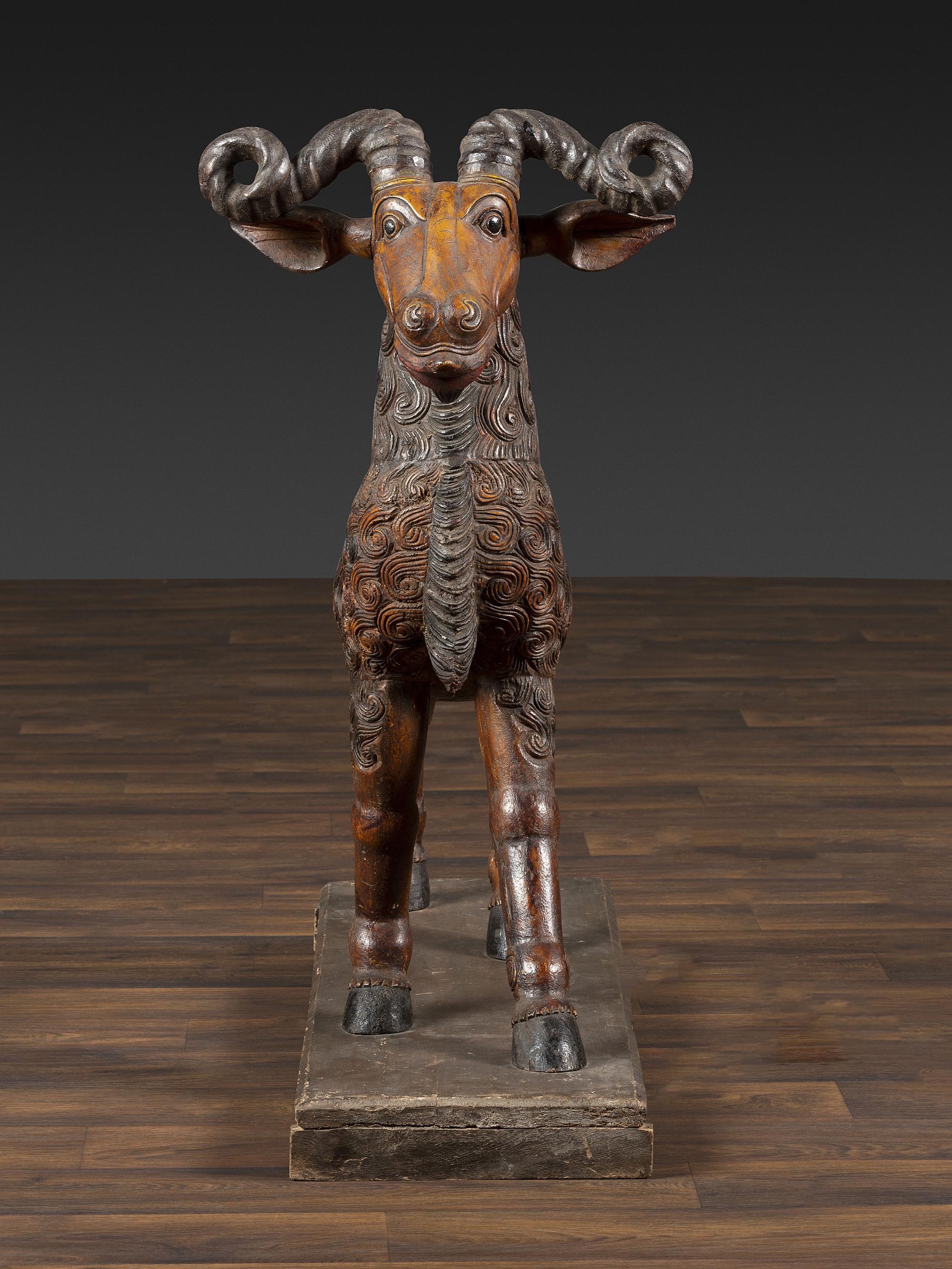 A Folk Art Carved and Painted Wood Ram