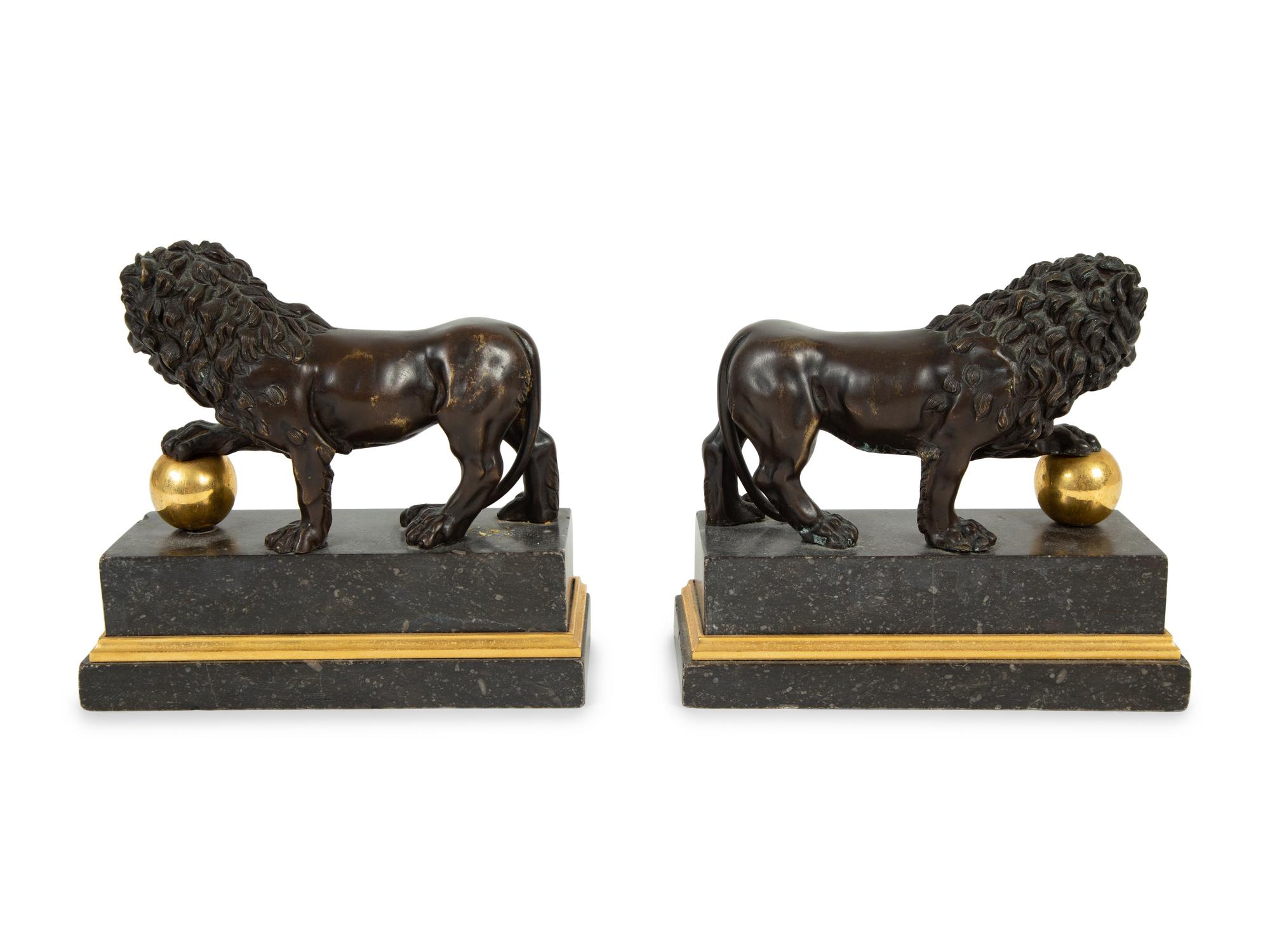 A Pair of Continental Patinated and Gilt Bronze Medici Lions