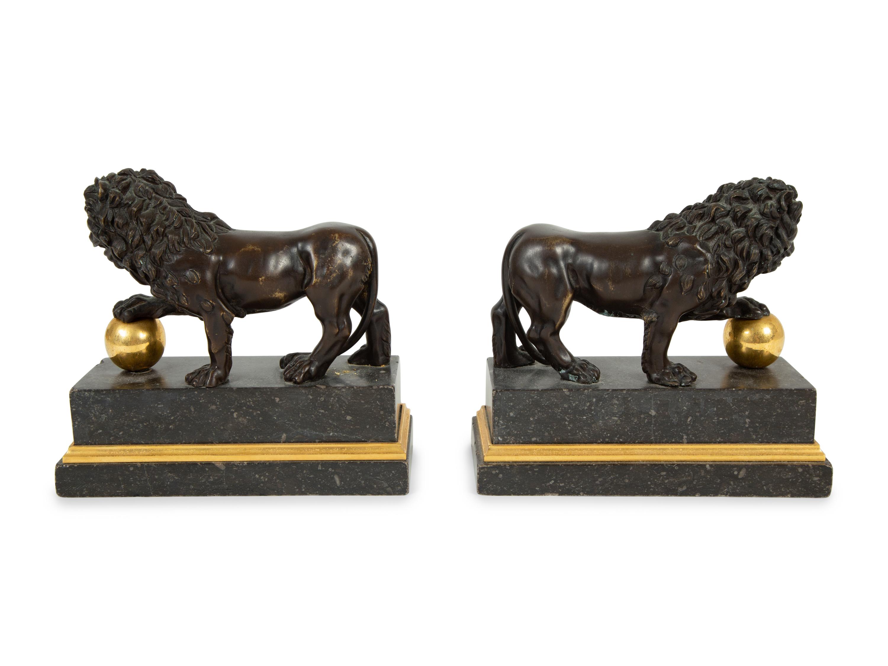 A Pair of Continental Patinated and Gilt Bronze Medici Lions