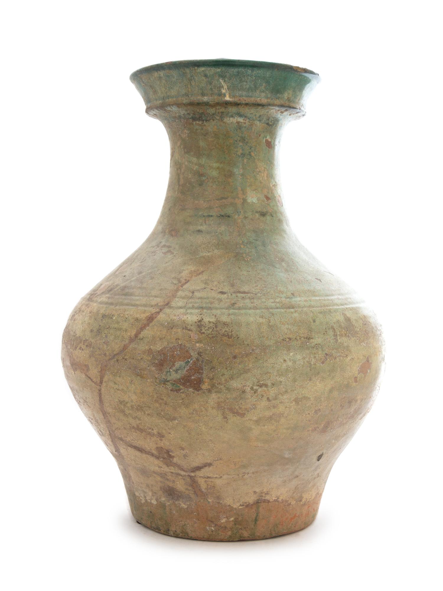 A Chinese Green Glazed Pottery Hu Height 15 inches. — HAN DYNASTY (206 B.C. - A.D. 220)