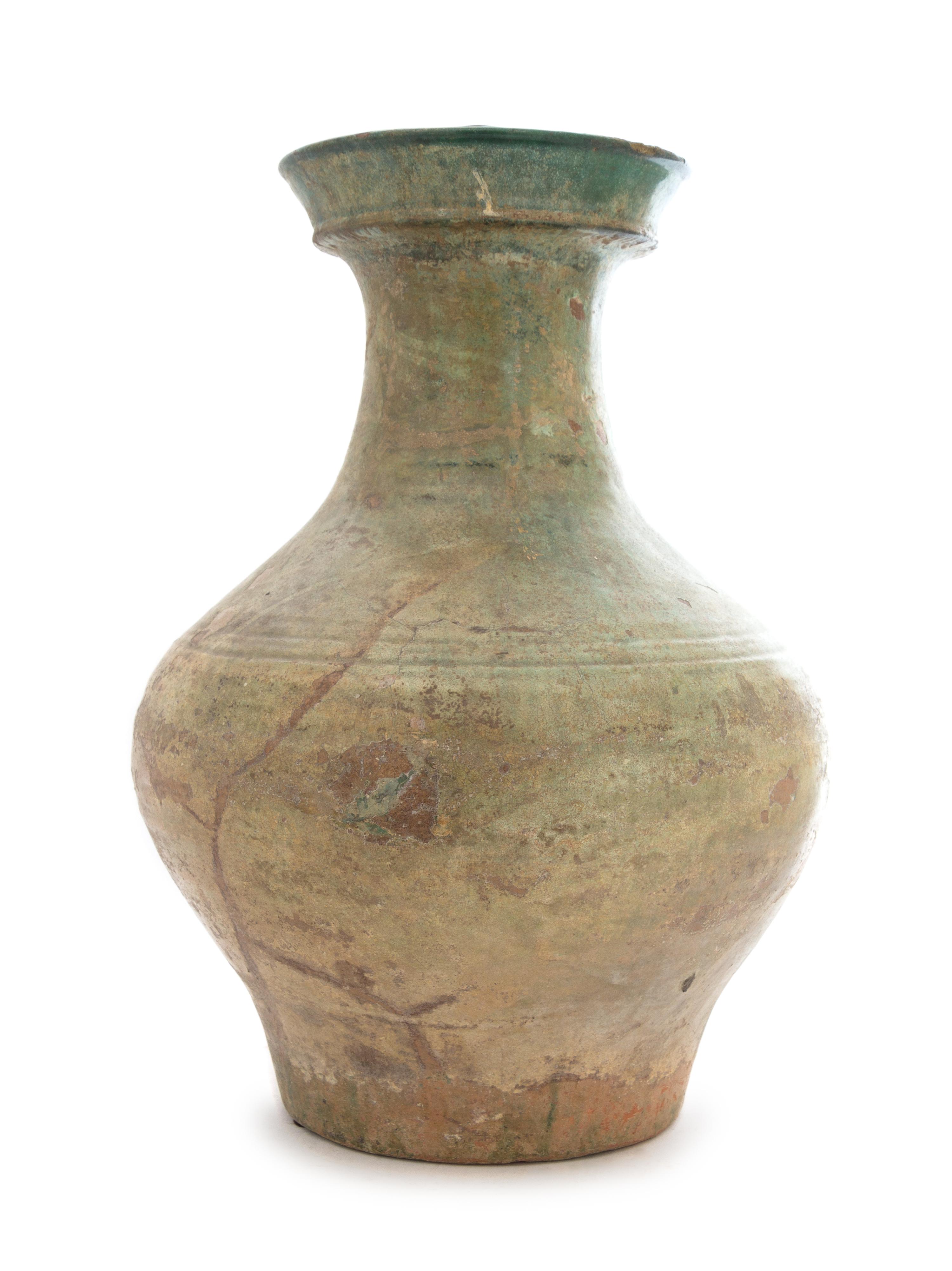A Chinese Green Glazed Pottery Hu Height 15 inches. — HAN DYNASTY (206 B.C. - A.D. 220)