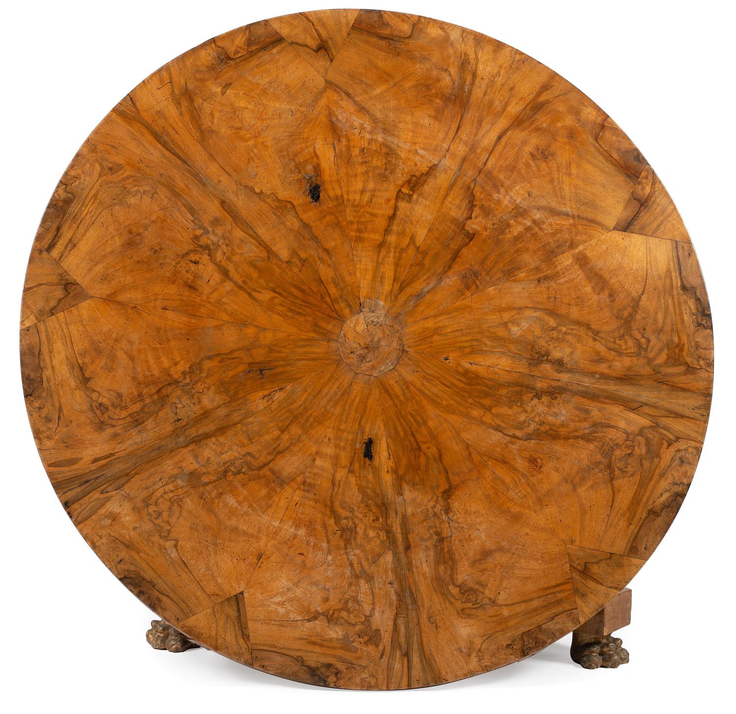 A Continental Neoclassical Parcel Gilt and Ebonized Burlwood Veneered Dining Table