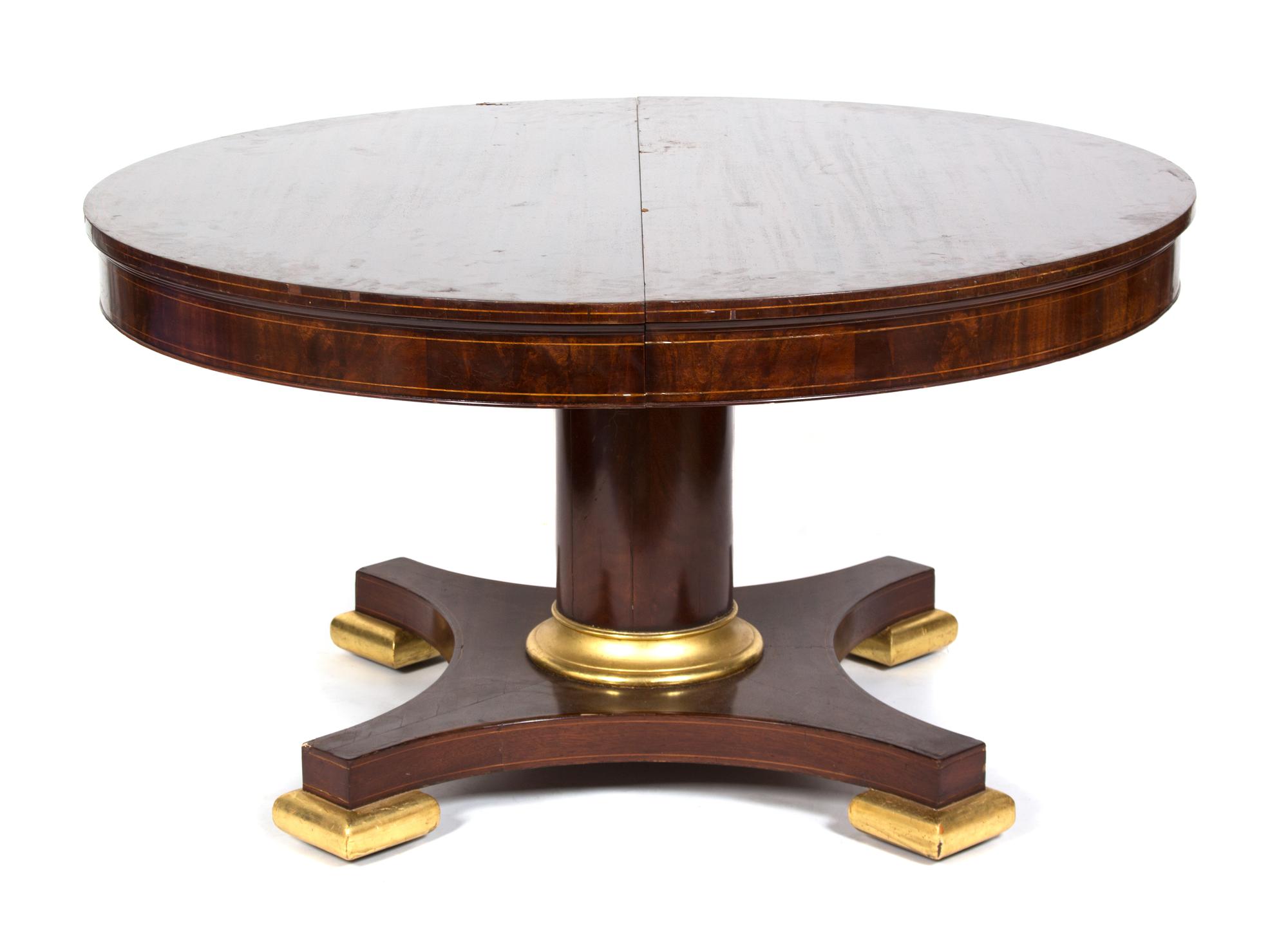 A Regency Style Dining Table Height 29 1/2 x diameter 54 inches. — 19TH/20TH CENTURY