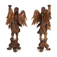 A Pair of Monumental Carved Walnut Figural Torchères