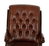 A Regency Style Leather Upholstered Mahogany Open Armchair — 20th Century