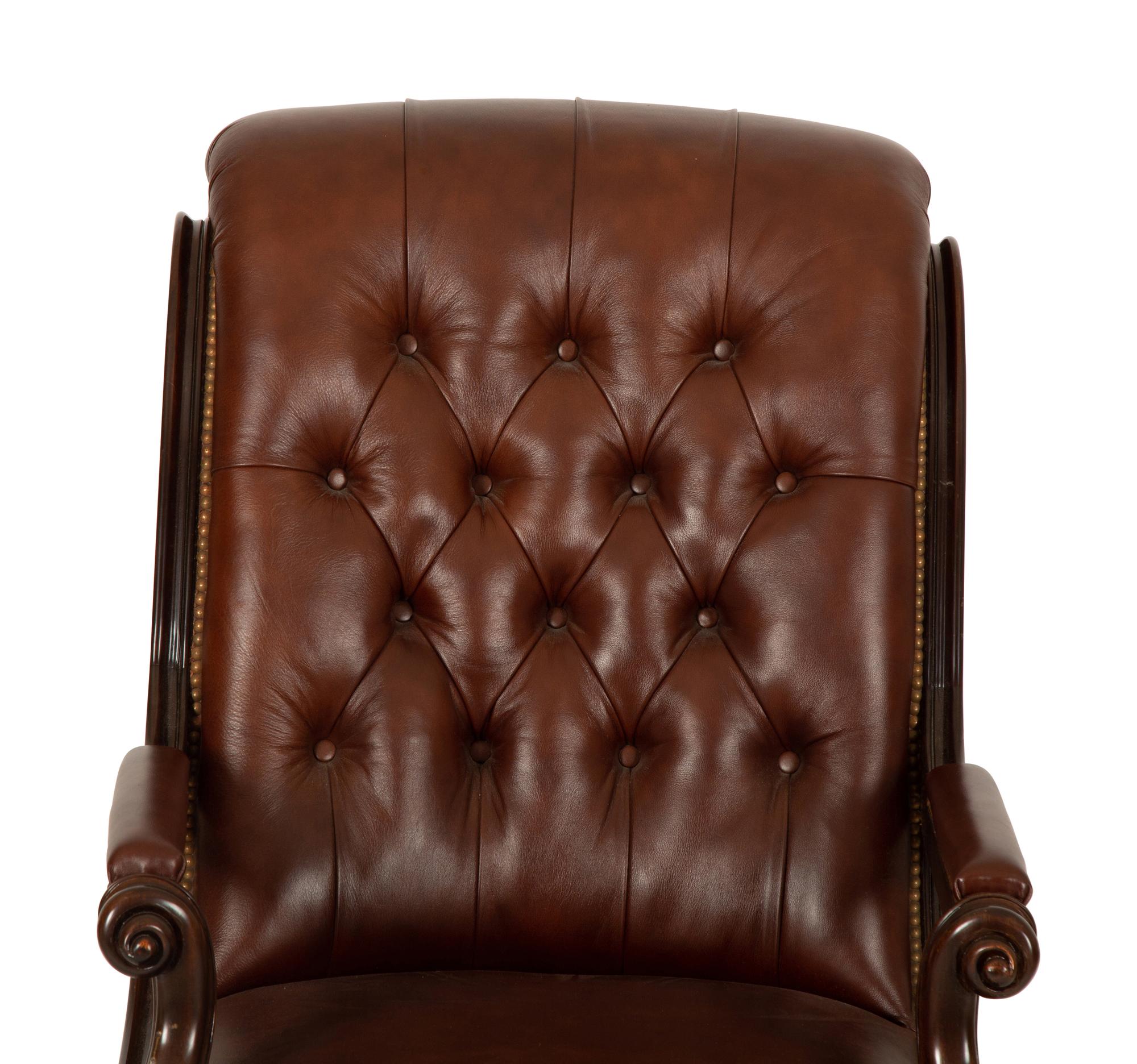 A Regency Style Leather Upholstered Mahogany Open Armchair — 20th Century