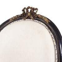 A Pair of Napoleon III Gilt Metal Mounted Ebonized Fauteuils