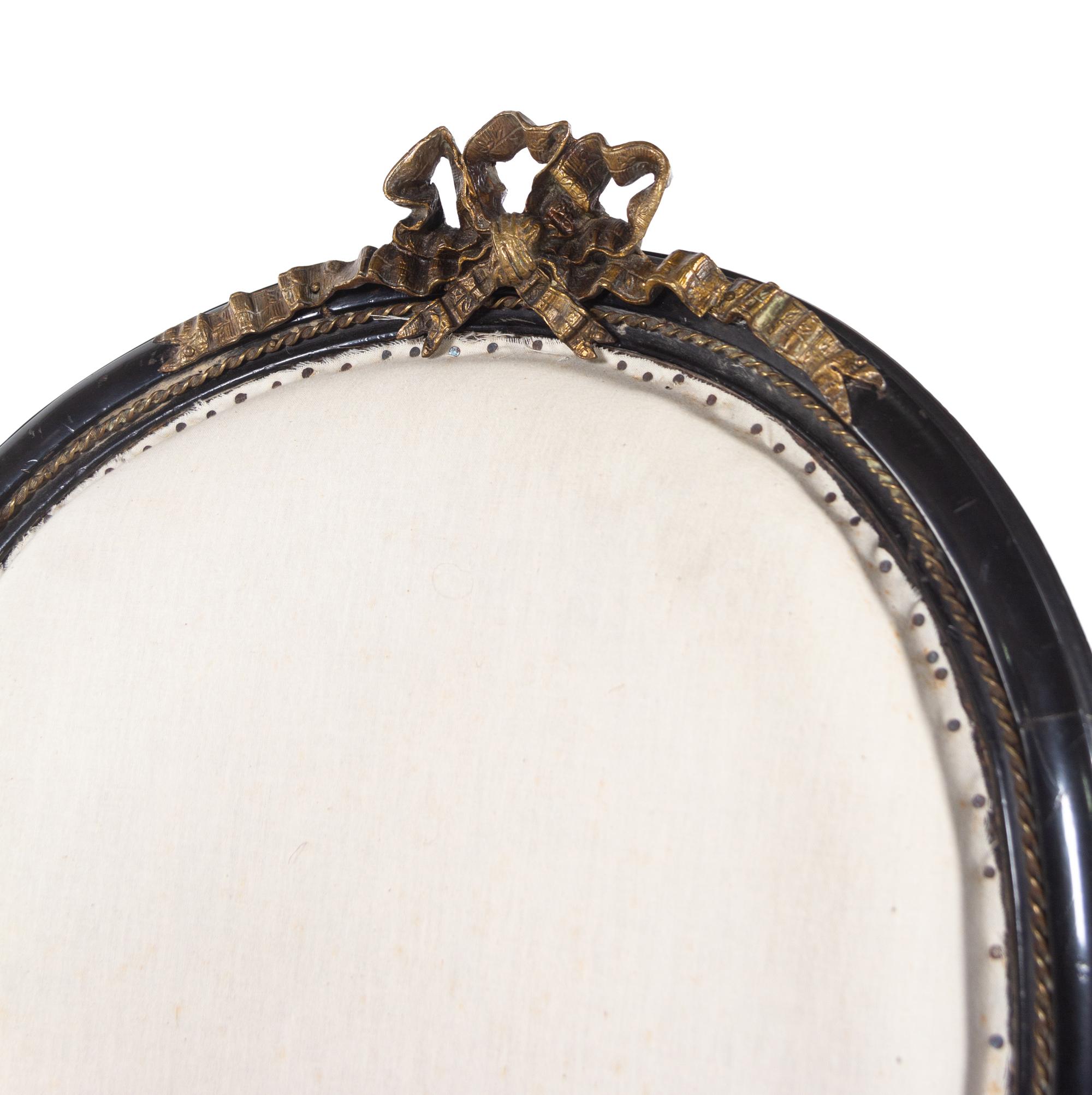 A Pair of Napoleon III Gilt Metal Mounted Ebonized Fauteuils