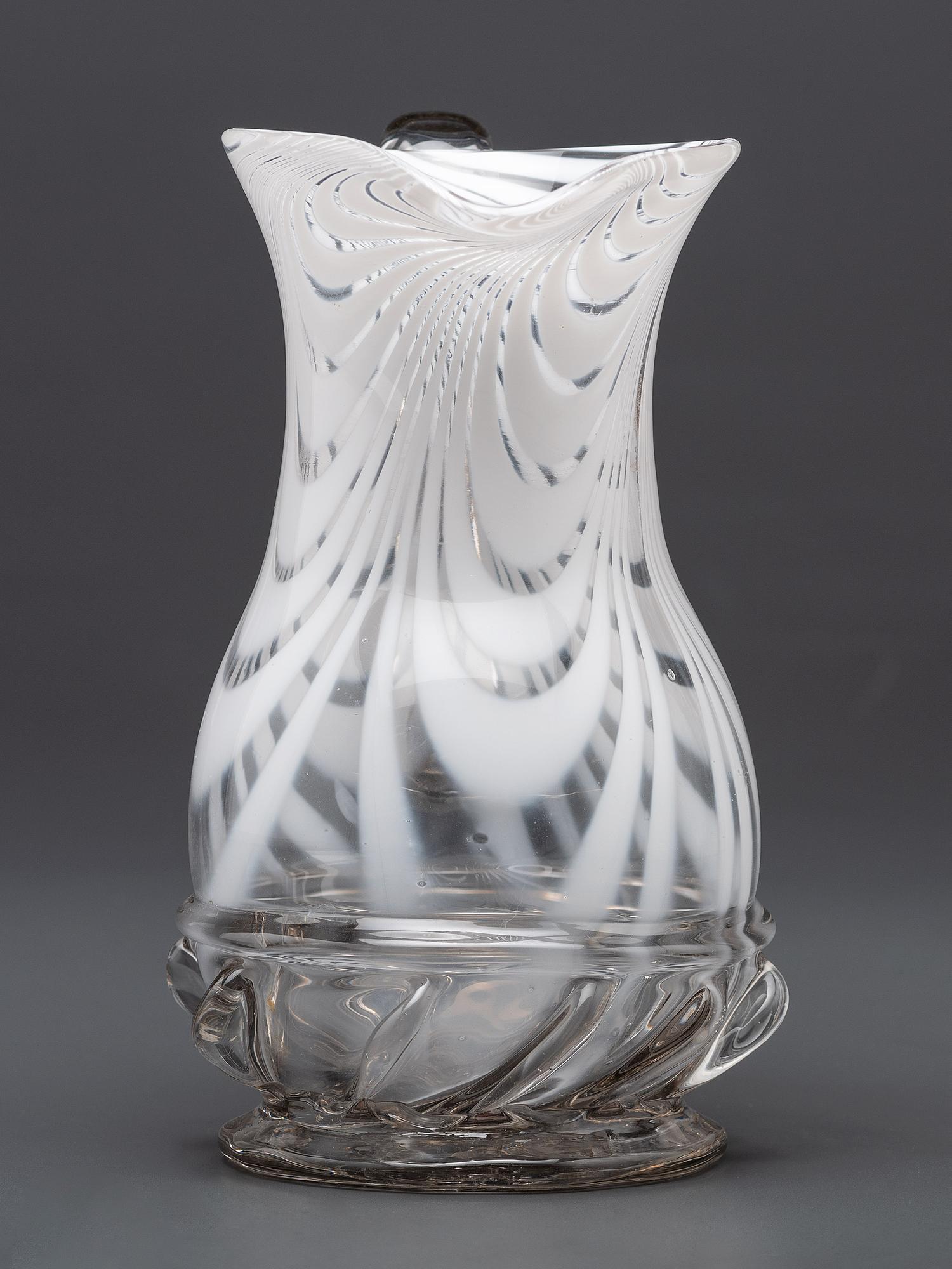 A New Jersey Blown-Glass Pitcher in Clear with White Swirls