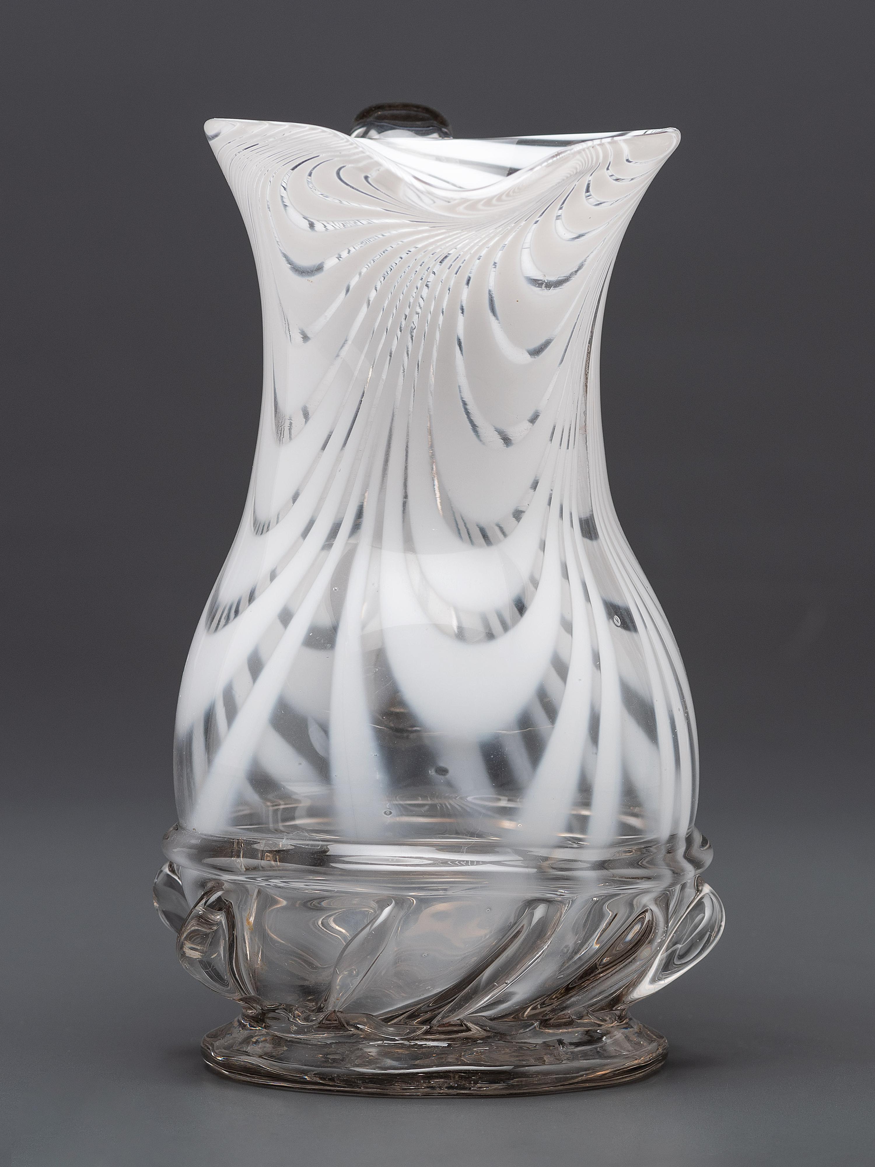 A New Jersey Blown-Glass Pitcher in Clear with White Swirls