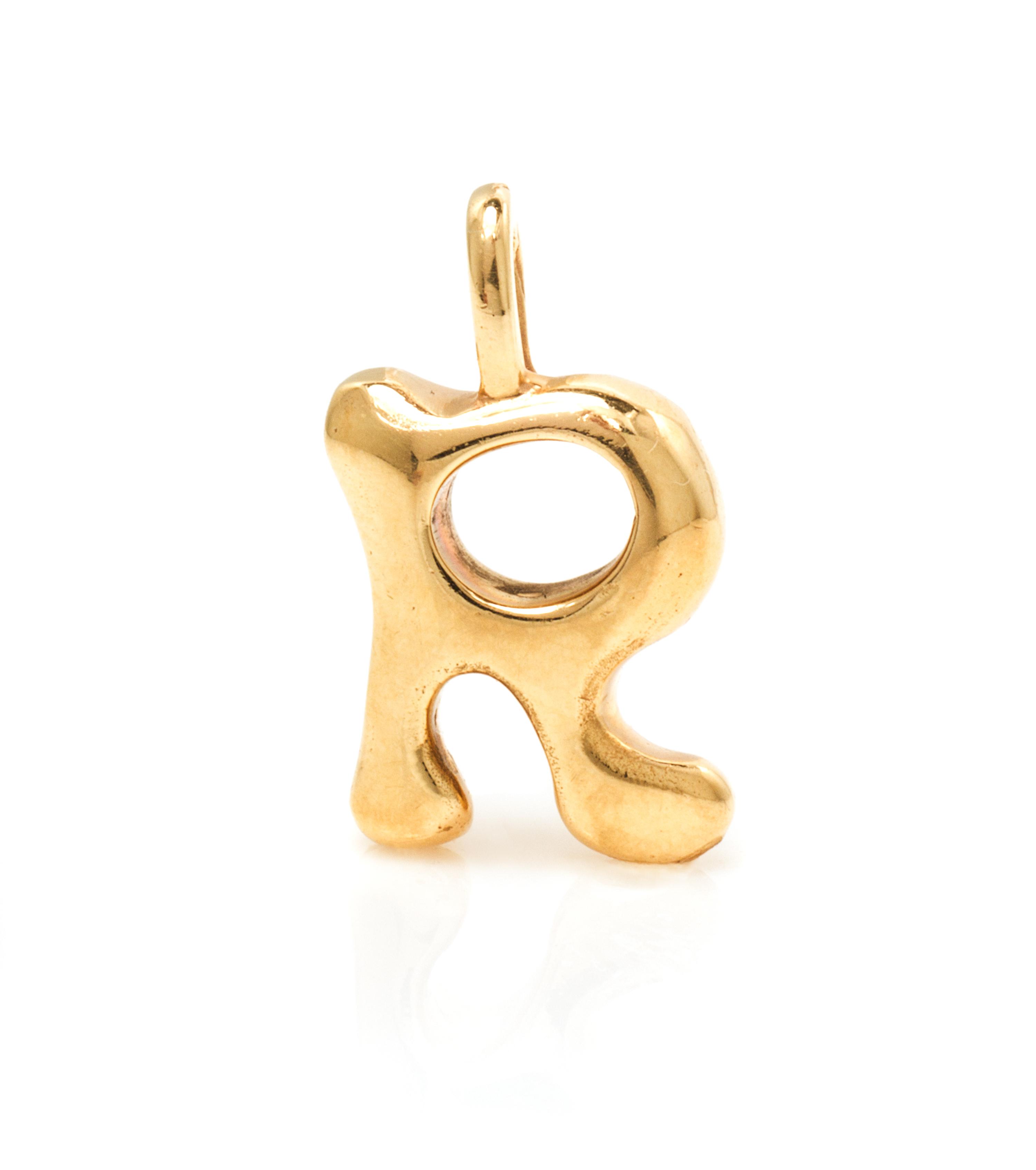 A Yellow Gold "R" Pendant. 6.10 dwts.