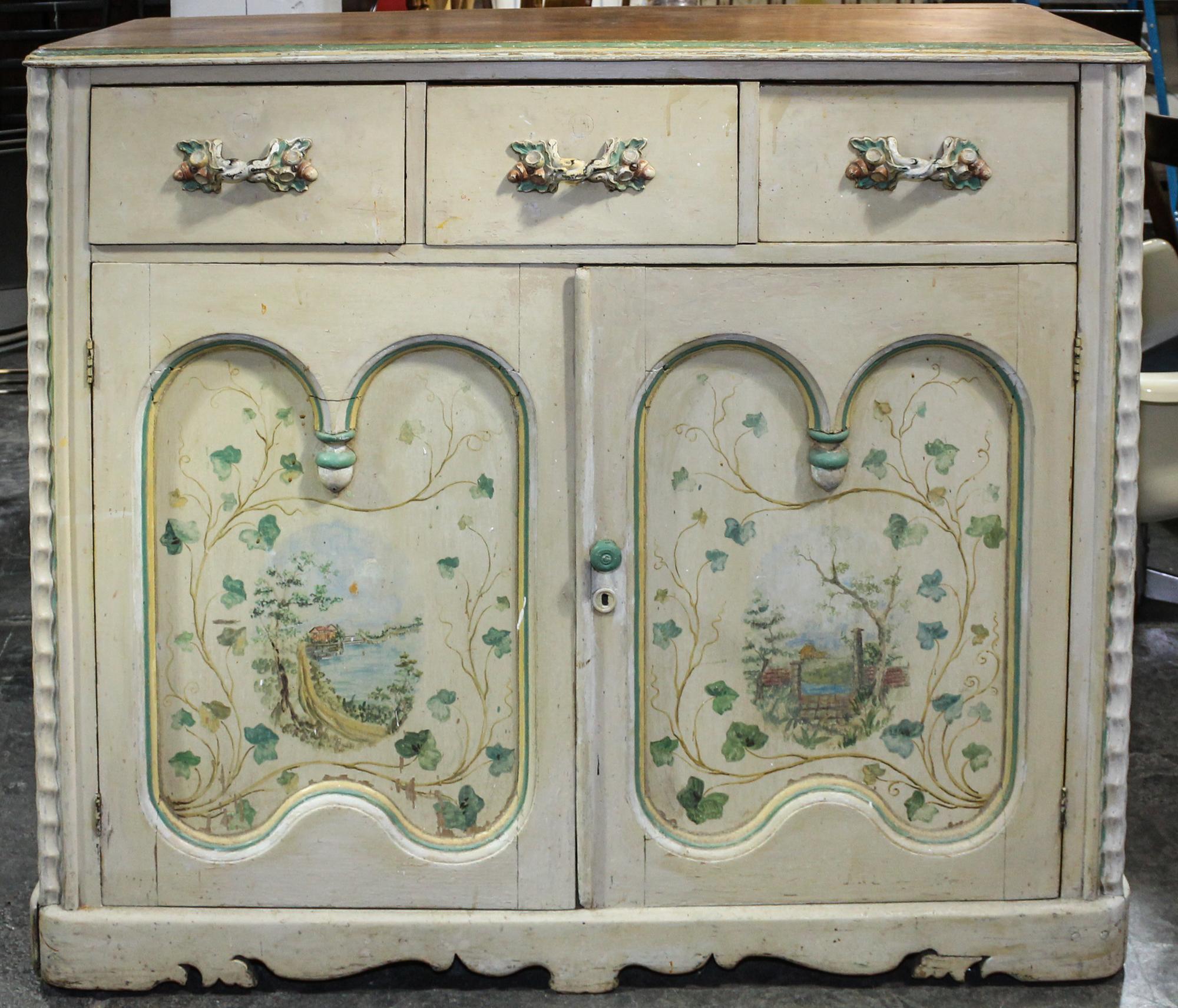 An Italian Style Painted Cabinet Height 40 1/4 x width 47 1/2 x depth 20 1/2 inches.