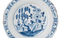 A Dutch Blue and White Glazed Delftware Charger