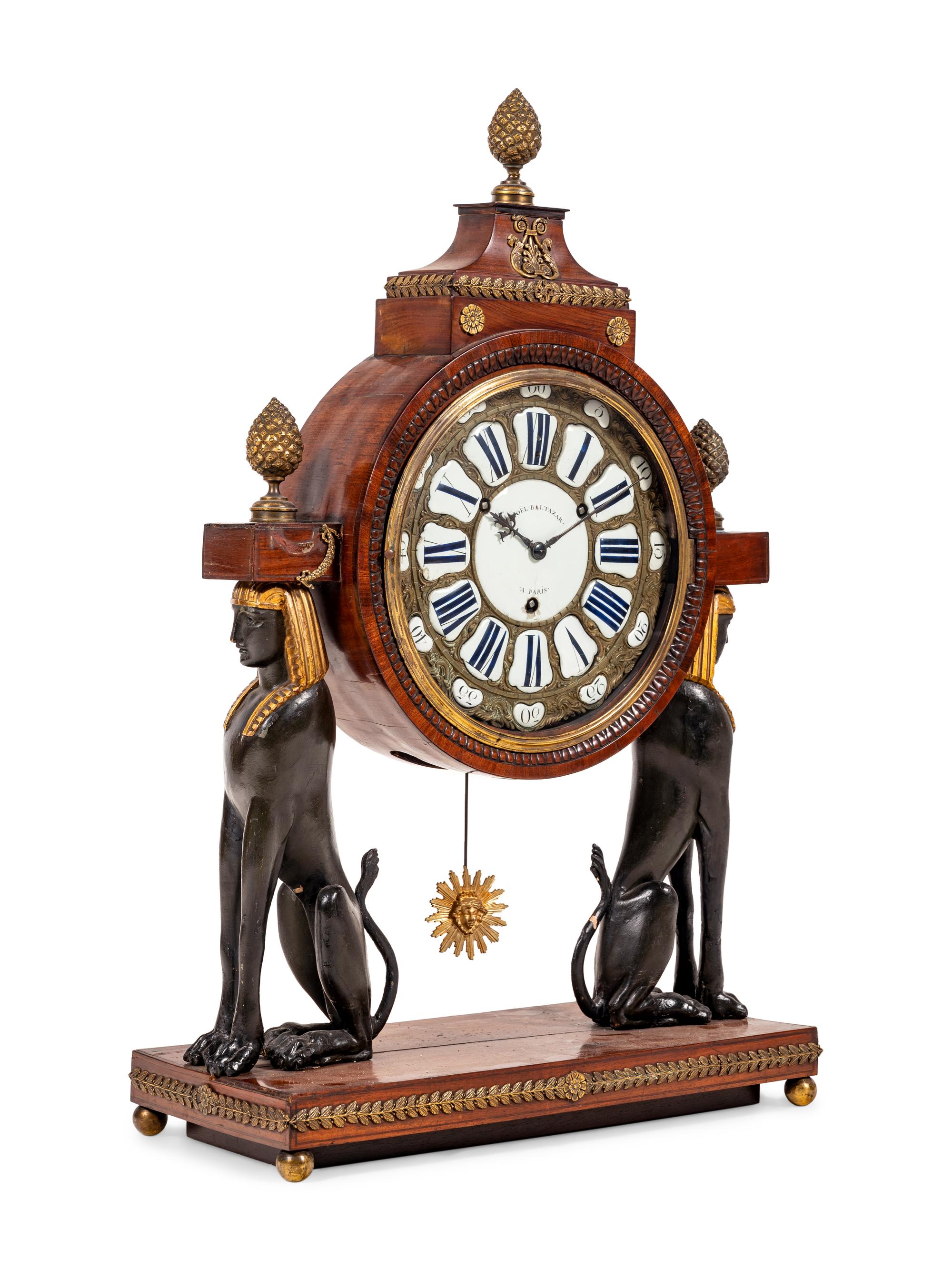 A French Egyptian Revival Gilt Bronze Mounted Mahogany Clock