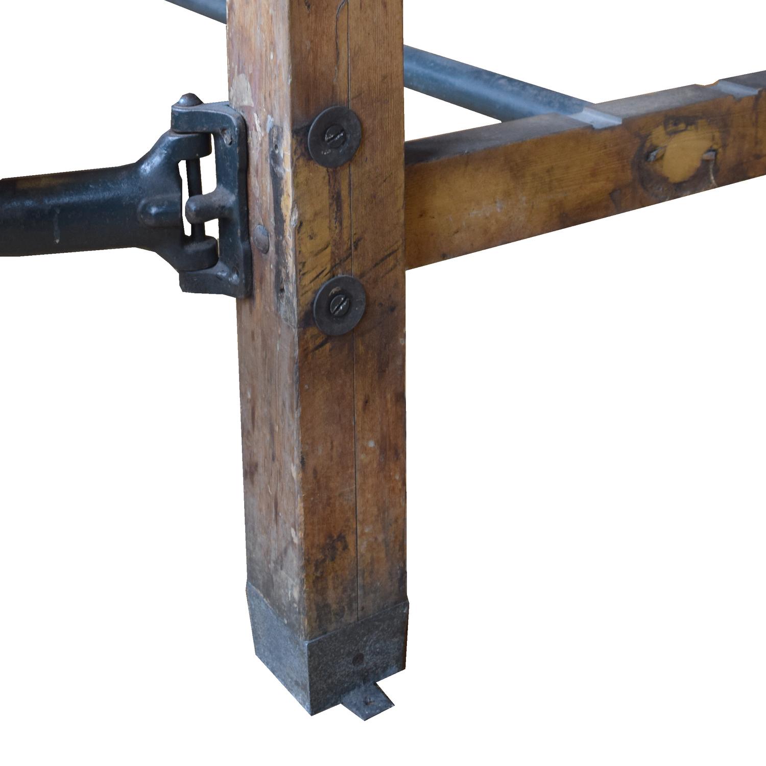An Industrial Table with Swing Arm Seats 71" W x 29.5" D x 30" H — United States, Circa 1930