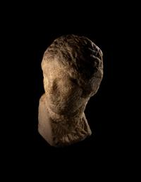 An Unfinished Greek Marble Head of a Woman