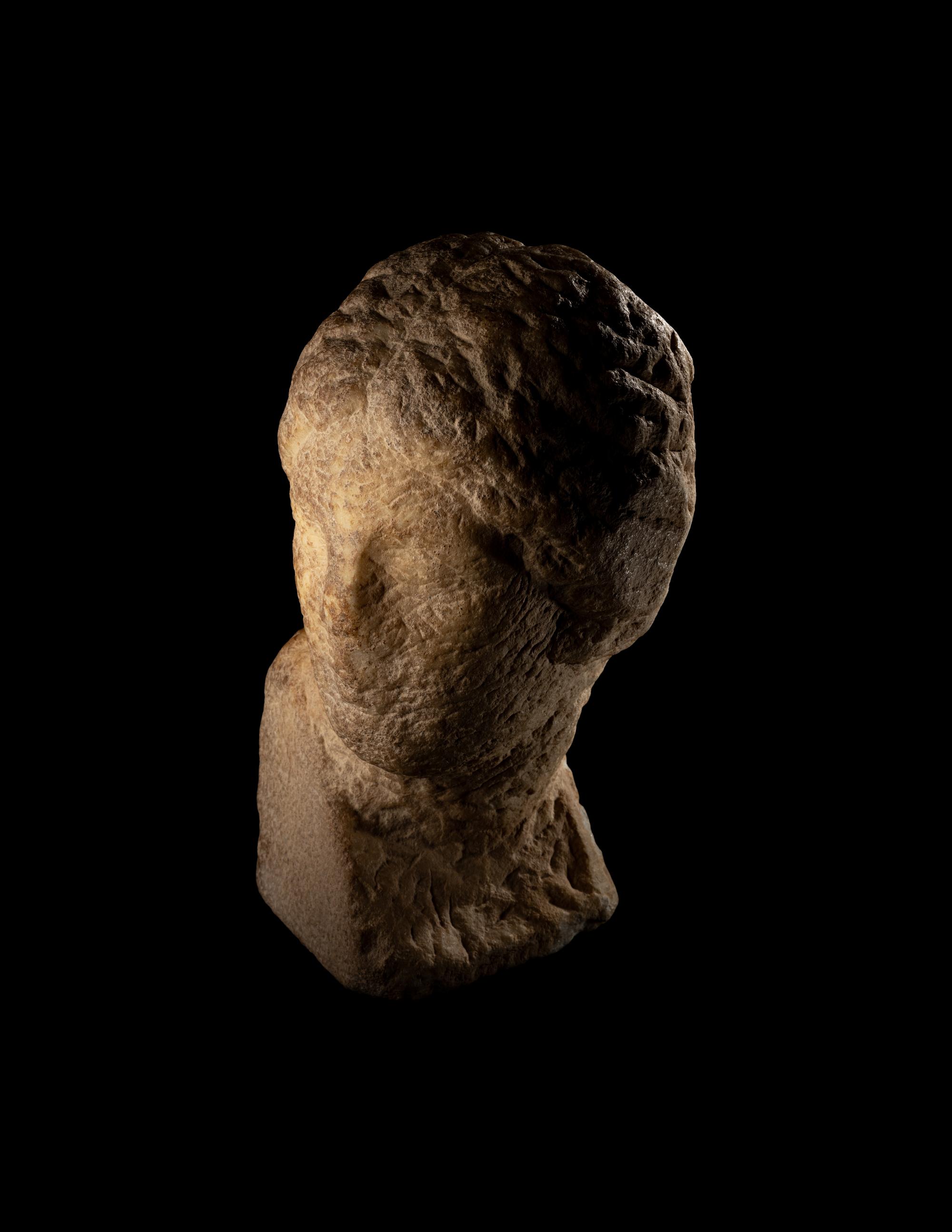 An Unfinished Greek Marble Head of a Woman
