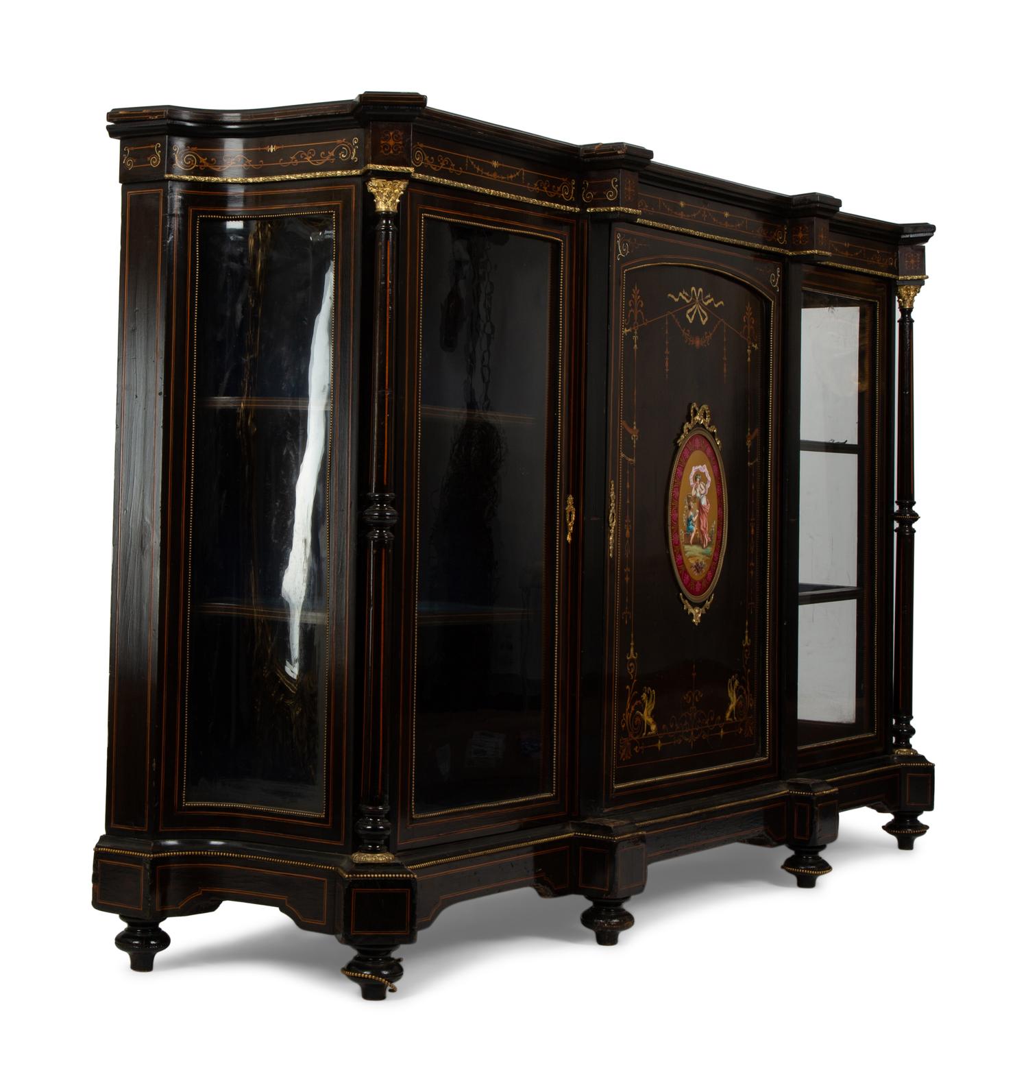 A Napoleon III Gilt Bronze and Porcelain Mounted Ebony and Marquetry Cabinet — CIRCA 1870